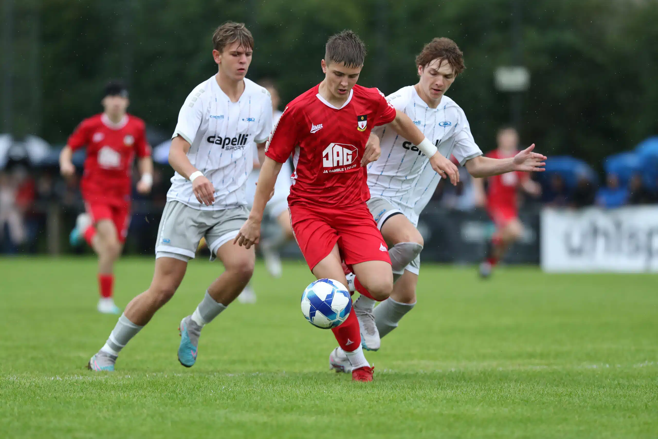 PressEye-Northern Ireland- 26th July  2023
Picture by Brian Little/PressEye
SuperCupNi 2023 - Boys Premier

Co Tyrone Dylan Crawford   and Northeast Rush Thomas Helmer and Nathan Meyer during Wednesday's Boys Premier  Group A match at Broughshane during the SUPERCUPNI.   
Picture by Brian Little/PressEye