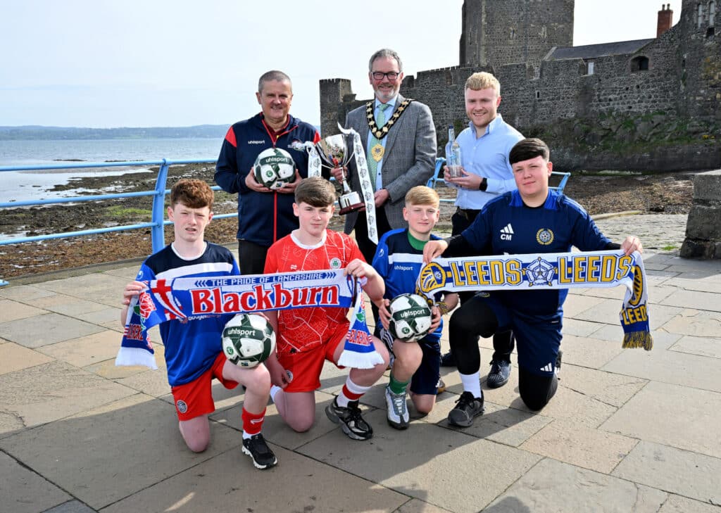 Shankill Juniors players Kylan Morrison and Carter McAllister, along with Cliftonville’s Keagan O’Connor and Ronan Vernon, are pictured with Alderman William McCaughey, Mayor of Mid & East Antrim Borough Council; Michael Willis, Director of the Budget Energy SuperCupNI; and Ollie Booth, National Account Manager at Clearer Water, to announce that Premier League newcomers Leeds United and Championship giants Blackburn Rovers will headline a world-class line-up in the Boys’ Minor Section at the 2025 Budget Energy SuperCupNI.