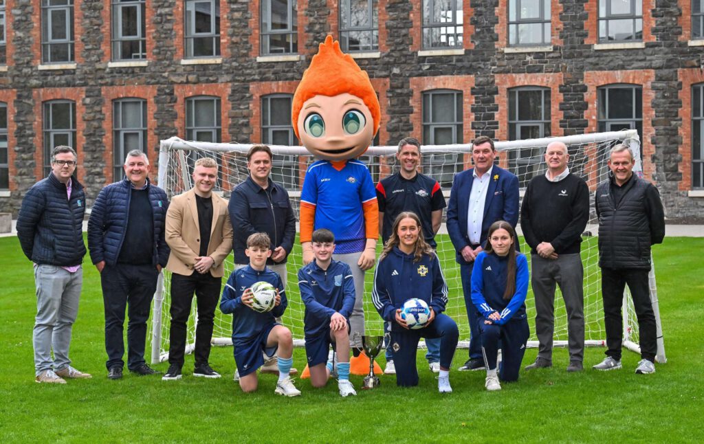 Northern Ireland U17 international and tournament graduate Chloe Beckinsale and Charlotte Havern are pictured alongside Ballymena United Minor Section players Curtis McKeown and Isaac Dixon, with former Northern Ireland international and current Northern Ireland U21 Manager Tommy Wright and Karl Bradley from Budget Energy at the official draw for the 2026 Budget Energy SuperCupNI. Also pictured are Karl Bradley from Budget Energy, Sparky the Budget Energy mascot, Diarmaid Dallat and Fergal McTague of Creagh Concrete, Ollie Booth from KLIR, and Brian Hutchinson and Dave Sanderson from Uhlsport.
